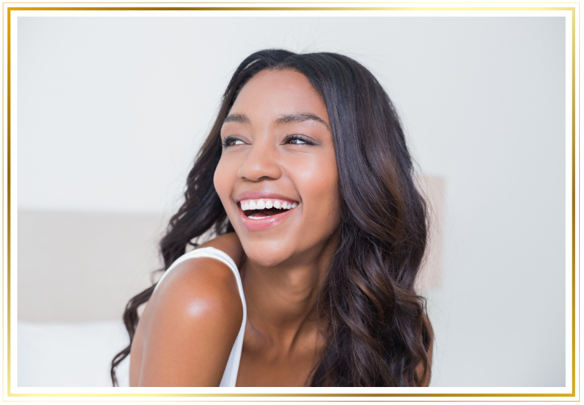 a woman smiling with long hair