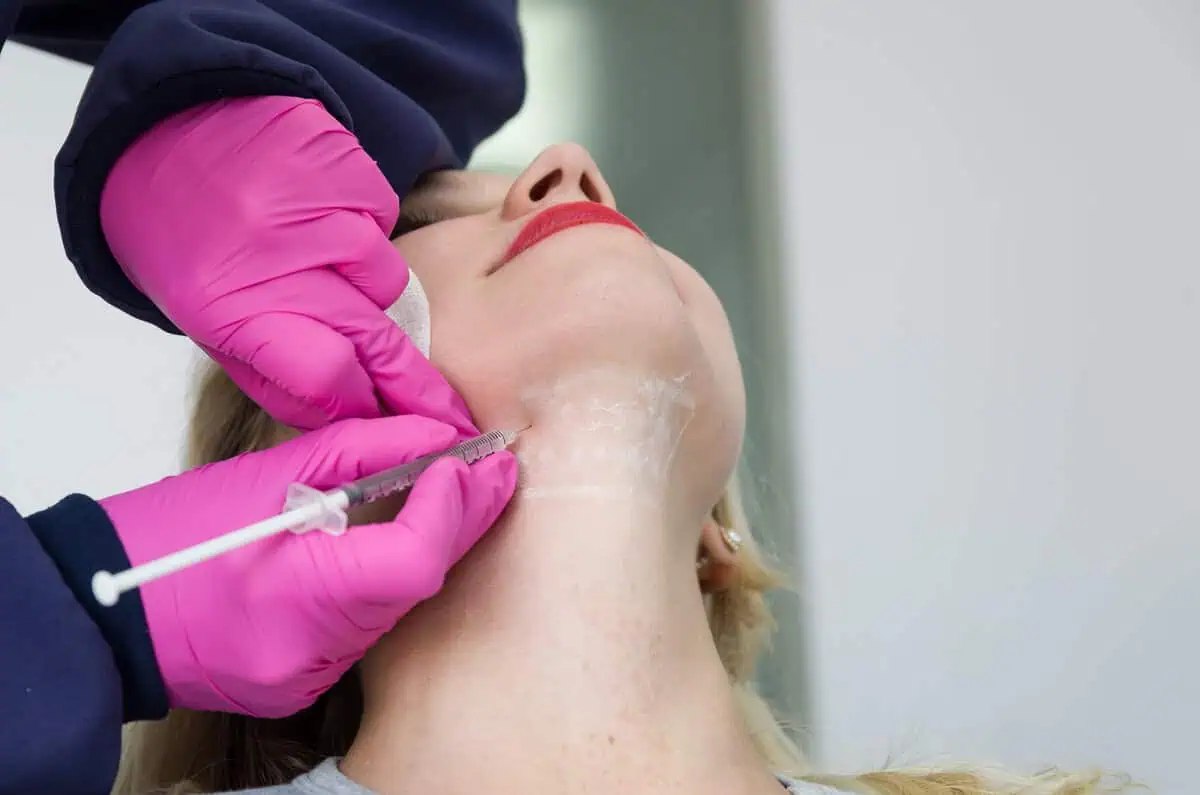 a person getting an injection in their face