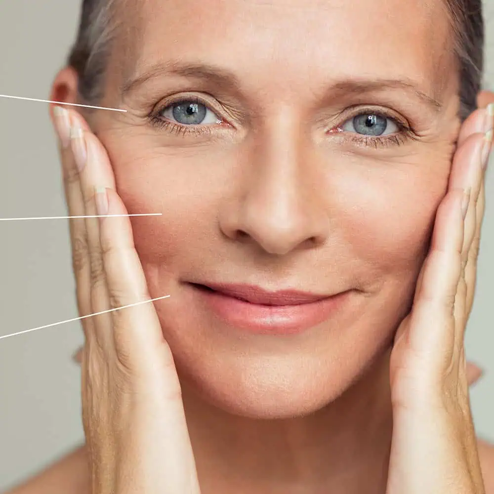 a woman touching her face